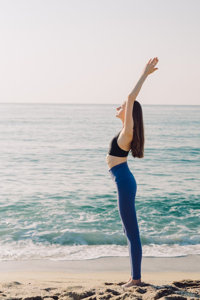 Peaceful scene of a woman meditating outdoors in a sunny summer setting, embodying wellness and tranquility.